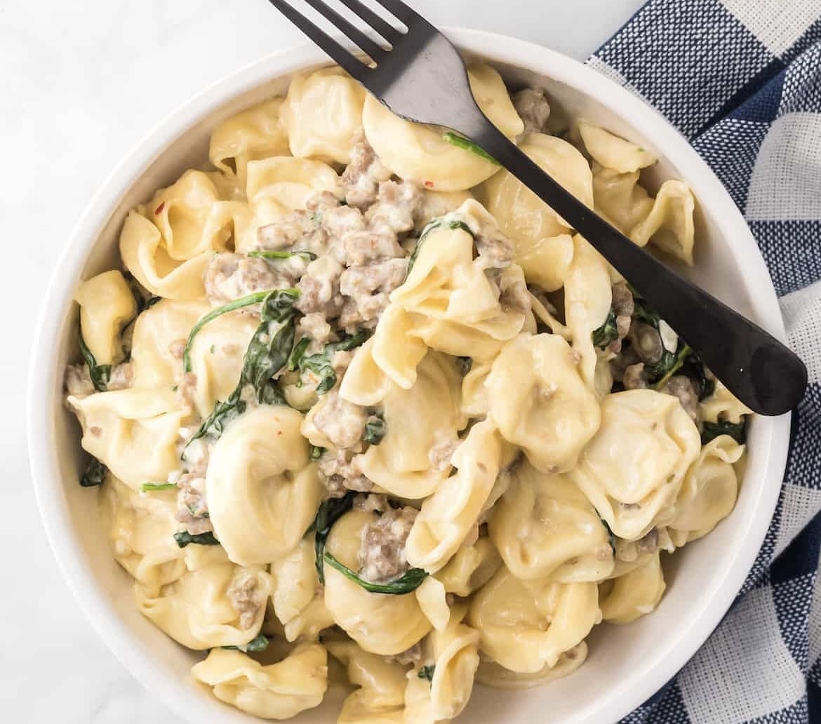 Creamy, cheesy tortellini with Italian sausage and spinach
